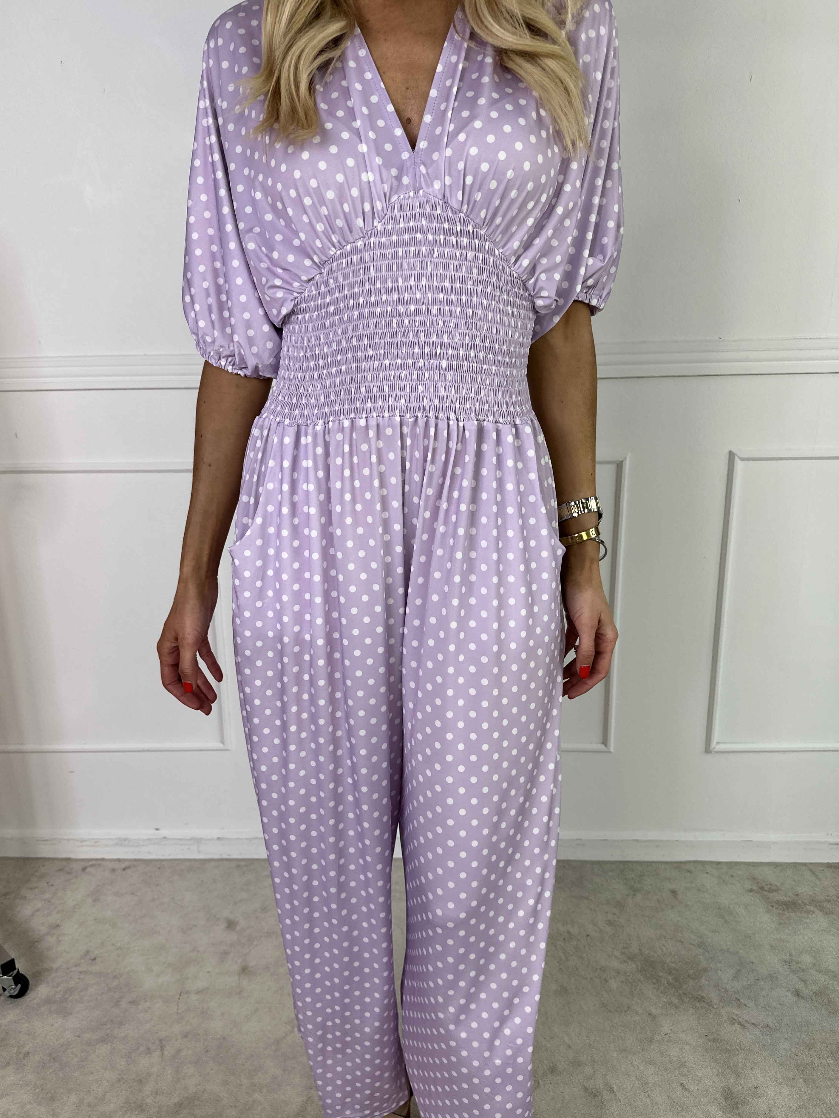 Grace - Stretchig jumpsuit med vita prickar
